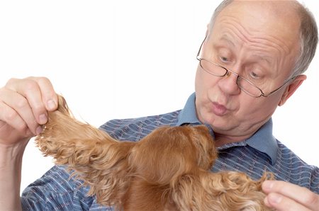 simsearch:400-04435288,k - Bald senior man with dog. Emotional portraits series. Isolated on white. Photographie de stock - Aubaine LD & Abonnement, Code: 400-04435287