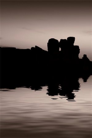 simsearch:400-05724389,k - The oldest free-standing building/temple in the world. Oldest neolithic prehistoric temple built thousands of years before the pyramids. - Hagar Qim & Mnajdra Temples in Malta, Mediterranean Sea, Europe - here seen silhouetted at sunset Stock Photo - Budget Royalty-Free & Subscription, Code: 400-04435688