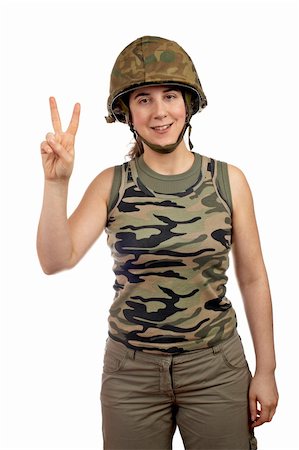 A beautiful soldier girl.  Victory gesture with the fingers Stock Photo - Budget Royalty-Free & Subscription, Code: 400-04435974