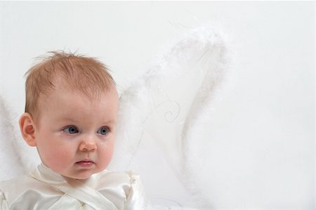 cute little girl dressed like fairy with fluffy wings is crying Stock Photo - Budget Royalty-Free & Subscription, Code: 400-04436228