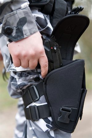 gun holster with a 9mm weapon inside Stock Photo - Budget Royalty-Free & Subscription, Code: 400-04436348