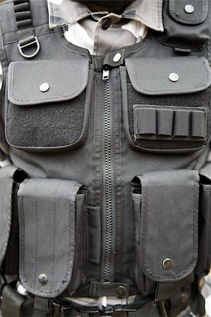 black S.W.A.T vest - part of soldier's equipment Fotografie stock - Microstock e Abbonamento, Codice: 400-04436350