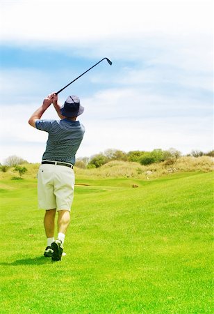 simsearch:400-04942072,k - Golfer hitting the ball from the fairway. Golf club is in slight motion. Foto de stock - Royalty-Free Super Valor e Assinatura, Número: 400-04437084