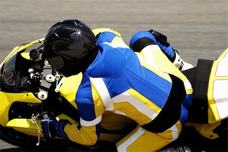 Close-up of a biker on superbike on track in South Africa. All the logos have been removed. Stock Photo - Budget Royalty-Free & Subscription, Code: 400-04437097