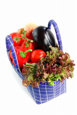 simsearch:400-03914983,k - Fresh vegetables and fruits in a basket isolated on white background Photographie de stock - Aubaine LD & Abonnement, Code: 400-04437499