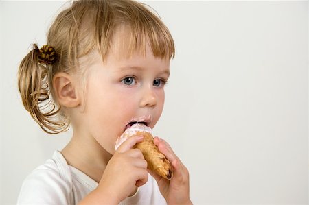 young girl eating tasty ice cream Stock Photo - Budget Royalty-Free & Subscription, Code: 400-04437534