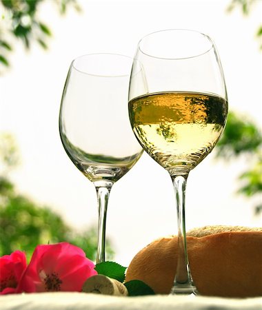 simsearch:400-04538167,k - Two wineglasses with white wine on the table outside Photographie de stock - Aubaine LD & Abonnement, Code: 400-04438191