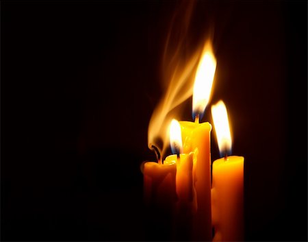 simsearch:400-07224190,k - Four Candles isolated over dark background. Photographie de stock - Aubaine LD & Abonnement, Code: 400-04438534