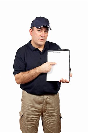 Courier holding a clipboard and pointing with the finger Stock Photo - Budget Royalty-Free & Subscription, Code: 400-04439230