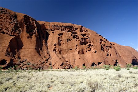 simsearch:400-04975317,k - A section of Ayers Rock in the outback of Australia. Fotografie stock - Microstock e Abbonamento, Codice: 400-04439285