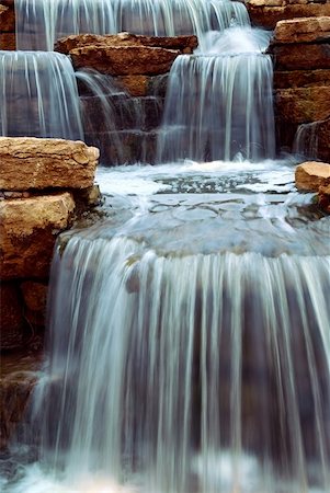 simsearch:400-04452321,k - Beautiful cascading waterfall over natural rocks, landscaping element Foto de stock - Royalty-Free Super Valor e Assinatura, Número: 400-04439528