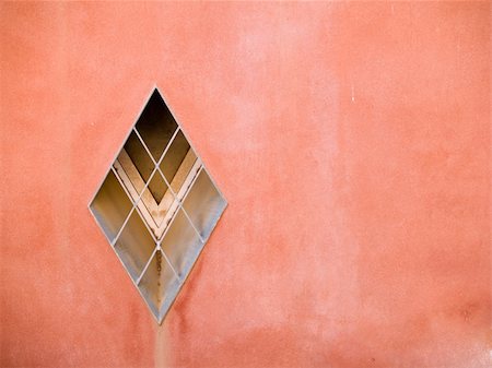 Architectural detail - A window on a red wall Stockbilder - Microstock & Abonnement, Bildnummer: 400-04439589
