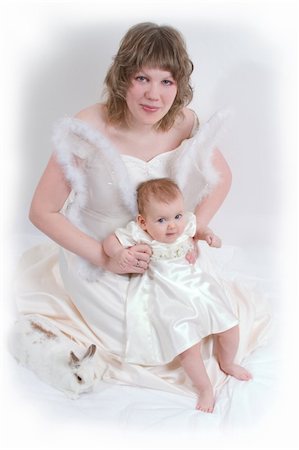 simsearch:400-04436228,k - mother and baby with rabbit are posing on white and looking into the camera Stock Photo - Budget Royalty-Free & Subscription, Code: 400-04430247