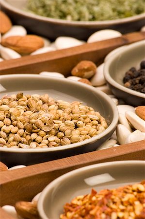 simsearch:400-04569188,k - Coriander seeds and various spices close up in a wooden tray. Stock Photo - Budget Royalty-Free & Subscription, Code: 400-04430355