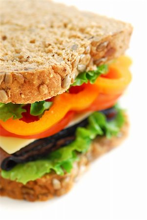 Big healthy sandwich with vegetables and meat close up Foto de stock - Super Valor sin royalties y Suscripción, Código: 400-04430721