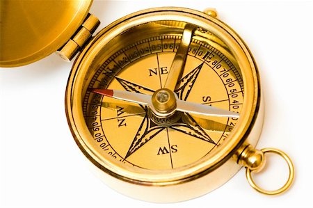 simsearch:400-07714543,k - Old style brass compass on white background Fotografie stock - Microstock e Abbonamento, Codice: 400-04430977