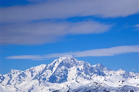 snow covered cliff - snowed mountainrange surrounded by  clouds Stock Photo - Budget Royalty-Free & Subscription, Code: 400-04431112