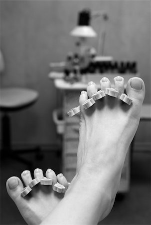 paint toe nails - Barefooted female legs in a pedicure study. b/w Stock Photo - Budget Royalty-Free & Subscription, Code: 400-04431549