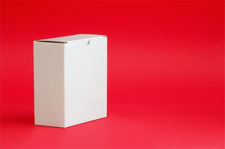 simsearch:400-09225864,k - White Cardboard box on red background Stock Photo - Budget Royalty-Free & Subscription, Code: 400-04431654