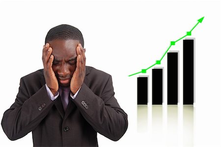 This is an image of businessman frustrated by the rise in the graph which has affect his company sales. This can be used to represent themes such as "Competitive Disadvantage" and "Negative Impact". Fotografie stock - Microstock e Abbonamento, Codice: 400-04431650