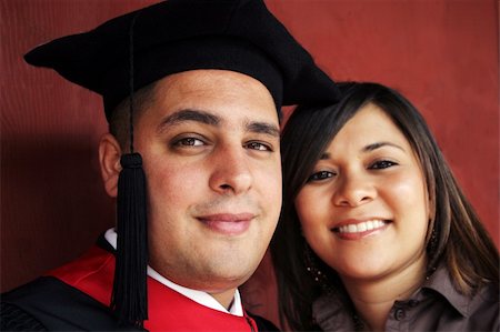 people successful college graduate with family - University graduate with his girlfriend (focus on the student) - happy and successful Stock Photo - Budget Royalty-Free & Subscription, Code: 400-04432400