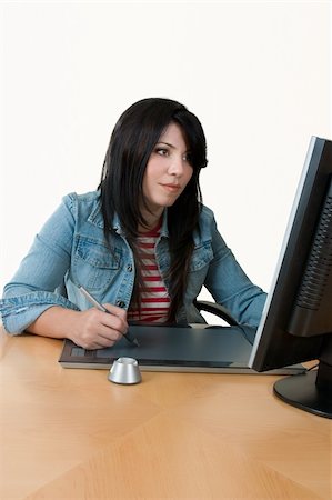 A female worker at computer with graphic tablet. Stock Photo - Budget Royalty-Free & Subscription, Code: 400-04432449