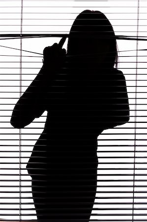 people peeking curtain - silhouette of woman looking through the blind (whte background) Stock Photo - Budget Royalty-Free & Subscription, Code: 400-04432804