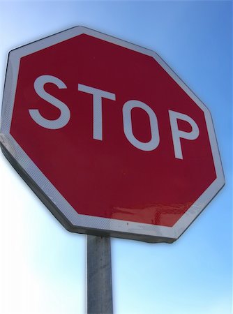 portrait of traffic stop sign in blue white sky Fotografie stock - Microstock e Abbonamento, Codice: 400-04432954