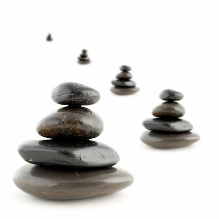 simsearch:400-04946108,k - Stacks of balanced stones with shadow on white background. Very shallow DOF Photographie de stock - Aubaine LD & Abonnement, Code: 400-04433418