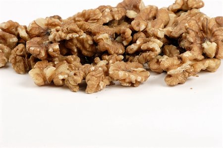 simsearch:400-04415203,k - Multiple open Walnuts set against a plain background Fotografie stock - Microstock e Abbonamento, Codice: 400-04433460