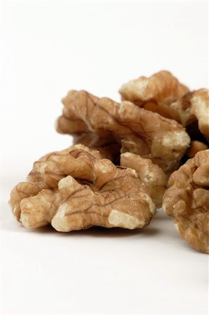 simsearch:400-04173906,k - Multiple open Walnuts set against a plain background Stock Photo - Budget Royalty-Free & Subscription, Code: 400-04433476