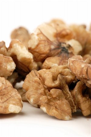 simsearch:400-04820004,k - Multiple open Walnuts set against a plain background Stockbilder - Microstock & Abonnement, Bildnummer: 400-04433477