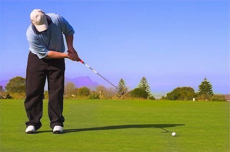 simsearch:400-05370464,k - Golfer putting on the green. Stock Photo - Budget Royalty-Free & Subscription, Code: 400-04433551