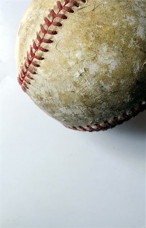 Closeup of a battered old baseball against a white background. Stock Photo - Budget Royalty-Free & Subscription, Code: 400-04433667