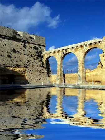 photos of the knights of malta - Medieval castle & moat situated in a strategic defensive location, in Malta Stock Photo - Budget Royalty-Free & Subscription, Code: 400-04433740