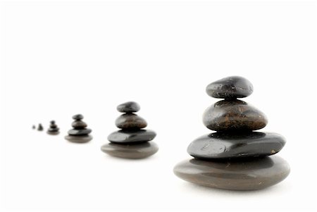 simsearch:400-04946108,k - Stacks of balanced stones with shadow on white background. Very shallow DOF Photographie de stock - Aubaine LD & Abonnement, Code: 400-04433778