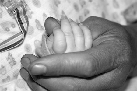 Father Holding Baby's Hand Stock Photo - Budget Royalty-Free & Subscription, Code: 400-04433772