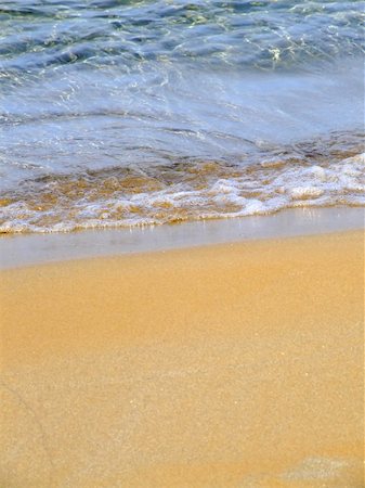 simsearch:400-08709392,k - Detail of gentle surf breaking onto a sandy shore Photographie de stock - Aubaine LD & Abonnement, Code: 400-04433929