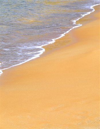 simsearch:400-08709392,k - Detail of gentle surf breaking onto a sandy shore Photographie de stock - Aubaine LD & Abonnement, Code: 400-04433930