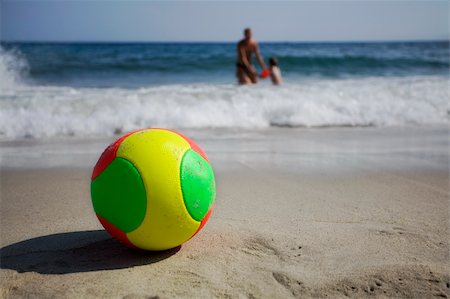 father and son playing football at beach - summer days Stock Photo - Budget Royalty-Free & Subscription, Code: 400-04444149