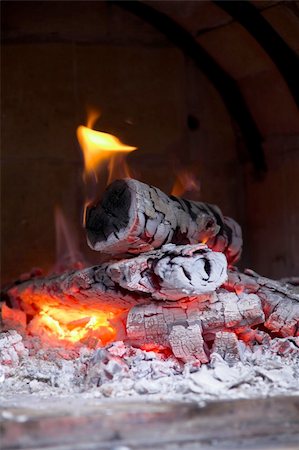 A wood stove-heating, burning some wood very slowly Stock Photo - Budget Royalty-Free & Subscription, Code: 400-04444189