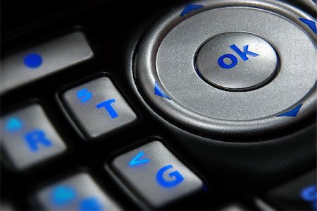 simsearch:400-03992117,k - Close up on key pad of a cell phone with focus on 'OK' button Stock Photo - Budget Royalty-Free & Subscription, Code: 400-04444492