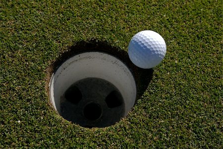 simsearch:400-05370464,k - Image of a golf ball next to hole - overhead view Stock Photo - Budget Royalty-Free & Subscription, Code: 400-04444514