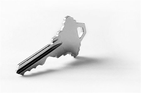Single key standing up - close up of a key Foto de stock - Super Valor sin royalties y Suscripción, Código: 400-04444620