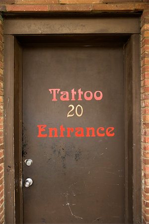 Doorway entrance to tattoo parlor. Stockbilder - Microstock & Abonnement, Bildnummer: 400-04445178