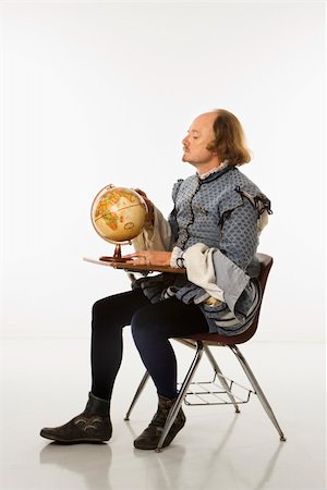 William Shakespeare in period clothing sitting in school desk looking at globe. Stock Photo - Budget Royalty-Free & Subscription, Code: 400-04445193