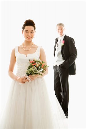 simsearch:400-04950359,k - Portrait of Caucasian groom and Asian bride. Stock Photo - Budget Royalty-Free & Subscription, Code: 400-04445225