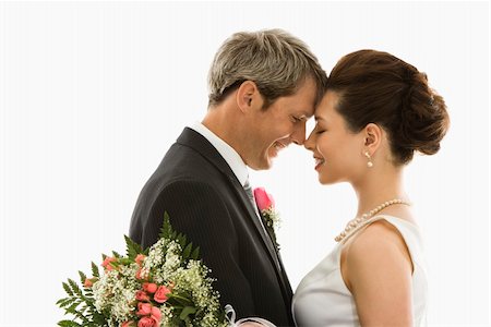 simsearch:400-04950359,k - Portrait of Caucasian groom and Asian bride embracing Stock Photo - Budget Royalty-Free & Subscription, Code: 400-04445221