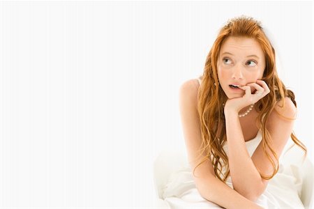 simsearch:400-04950359,k - Portrait of sitting Caucasian bride biting her finger and looking off to the side. Stock Photo - Budget Royalty-Free & Subscription, Code: 400-04445246