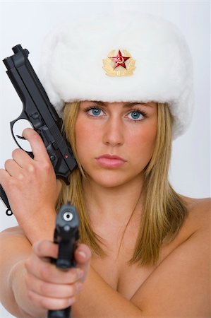 simsearch:400-04296682,k - A beautiful blonde Russian woman, armed and dangerous wering a fur hat and not much else Foto de stock - Royalty-Free Super Valor e Assinatura, Número: 400-04445297